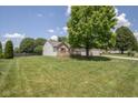 Exterior view of a house on a large lot, showcasing ample lawn space at 5642 Southern Mist Dr, Indianapolis, IN 46237