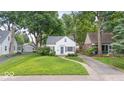 Charming single Gathering home with detached garage, mature trees and a well-manicured lawn at 6009 Ralston Ave, Indianapolis, IN 46220