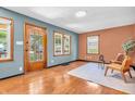 Bright living room with hardwood floors, a view of the outdoors, and comfortable seating at 696 W Mill St, Danville, IN 46122
