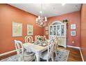 Elegant dining room with a classic chandelier and stylish furnishings at 712 Disciples Way, Greenwood, IN 46143