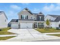 Charming two-story home features a two-car garage, stone accents, and a well-manicured front lawn at 7301 Deerberg Dr, Indianapolis, IN 46259