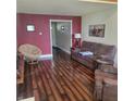 Comfortable living room with hardwood floors, stylish decor, and ample seating at 11985 Cat Tail Ct, Noblesville, IN 46060