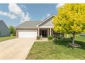 Charming single Gathering home featuring a well-manicured lawn and inviting front porch at 19555 Kailey Way, Noblesville, IN 46062