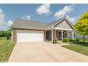 Inviting front exterior of home with a two-car garage and well-maintained lawn at 19555 Kailey Way, Noblesville, IN 46062