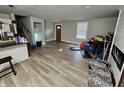 Spacious living room with light hardwood floors, neutral walls, and natural light at 3836 N Wittfield St, Indianapolis, IN 46235