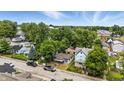 Aerial view capturing neighborhood street with houses, trees, and parked vehicles at 405 Harlan St, Indianapolis, IN 46201
