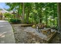 Cozy outdoor fire pit area with comfortable seating, perfect for entertaining and enjoying evenings in the backyard at 5720 Hickory Hollow Dr, Plainfield, IN 46168