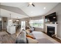 Spacious living room featuring a fireplace, high ceilings, and lots of natural light at 6420 Colt Ln, Anderson, IN 46013