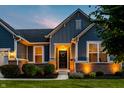 Beautiful home featuring brick accents, manicured lawn, and an inviting entryway with sidelights at 19009 Beverly Shones Ln, Noblesville, IN 46062