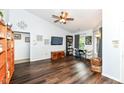 A spacious living room with wood floors and a ceiling fan and natural light coming from the window at 20845 Summit Rd, Noblesville, IN 46062
