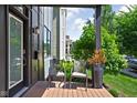 Inviting front porch offers seating and outdoor charm for relaxing in style at 2140 Alabama St, Indianapolis, IN 46202