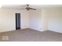 Spacious bedroom with neutral carpeting, ceiling fan and open doorway for easy access at 2931 Sentiment Ln, Greenwood, IN 46143