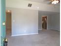 Bright living room with neutral paint, plush carpet and multiple entryways at 2996 Colony Lake W Dr, Plainfield, IN 46168