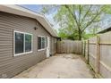 Fenced backyard featuring a concrete patio area and low-maintenance landscaping at 3149 Thayer St, Indianapolis, IN 46222