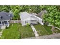 Charming single-story home with a well-manicured lawn and inviting front porch at 4129 Cornelius Ave, Indianapolis, IN 46208