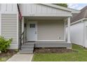 Inviting front porch with a white door and visible house number at 4129 Cornelius Ave, Indianapolis, IN 46208