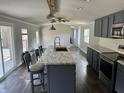 Modern kitchen with a large island, stainless steel appliances, and ample counter space at 4466 Buffalo Ln, Martinsville, IN 46151