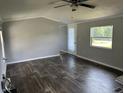 Inviting living room featuring elegant flooring, neutral walls, and a bright window at 4466 Buffalo Ln, Martinsville, IN 46151