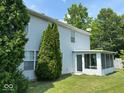 Private backyard showcasing an enclosed sunroom at 4912 Atlanta St, Anderson, IN 46013