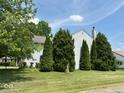 Spacious side yard with mature trees providing ample shade at 4912 Atlanta St, Anderson, IN 46013