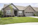 Attractive single-story brick home with a well-maintained lawn and fresh landscaping at 5081 Holborn Ave, McCordsville, IN 46055