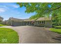 Attractive ranch home with a long drive, covered porch and brick facade at 5850 E 54Th Pl, Indianapolis, IN 46226