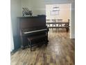 Open-concept dining room with a large wooden table perfect for entertaining at 597 W Adams St, Franklin, IN 46131