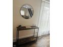 Welcoming foyer features a stylish mirror and a view of the staircase at 597 W Adams St, Franklin, IN 46131