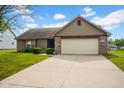 A well maintained home with attached two-car garage and a long driveway at 652 White Ash Trl, Mooresville, IN 46158