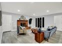 An inviting living room featuring a cozy fireplace, modern flooring and lots of natural light at 734 Summitcrest Dr, Indianapolis, IN 46241
