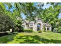 A stately home with lush landscaping, offering a serene and private setting, perfect for luxury living at 9690 Irishmans Run Ln, Zionsville, IN 46077