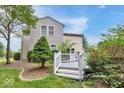 Backyard view featuring a white deck, trees, and mature landscaping, perfect for outdoor enjoyment at 1119 Albemarle Cir, Noblesville, IN 46062