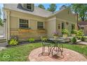 Charming home featuring a lovely outdoor seating area and manicured landscaping at 1149 E 56Th St, Indianapolis, IN 46220