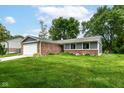 Attractive home featuring brick and siding, with an attached two-car garage at 12020 Colbarn Dr, Fishers, IN 46038