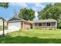 Lovely single-story home with a well-maintained lawn and brick accents at 12020 Colbarn Dr, Fishers, IN 46038