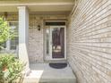 Close-up of the front door with brick facade and welcoming entrance at 1225 Berrywood Dr, Greenwood, IN 46143