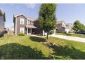 Two-story home with a neatly manicured lawn and tasteful landscaping at 2550 Cedarmill Dr, Franklin, IN 46131