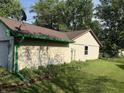 Spacious yard featuring lush greenery with mature trees and partial shade at 3309 Wedgewood Dr, Indianapolis, IN 46227