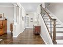 Inviting foyer with hardwood floors, staircase, and elegant decor at 4415 Summer Dr, Zionsville, IN 46077