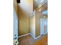 Entryway foyer with neutral walls, ceramic tile flooring and view of the second story at 6045 Copeland Mills Ct, Indianapolis, IN 46221