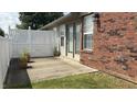 Patio area with a white fence, potted plants, and access to a door, perfect for relaxation at 6139 Robinwood Dr, Indianapolis, IN 46237