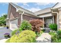 Inviting home exterior showcasing a brick facade and landscaped front entrance at 6656 Easy St, Fishers, IN 46038