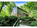 Charming exterior view with stairs and greenery surrounding the home, offering a peaceful retreat at 944 Briar Patch Ln, Greenwood, IN 46142