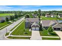 Aerial view of a beautiful home in a well-planned community with lush greenery and manicured lawns at 10917 Hunter Lake Ln, Indianapolis, IN 46239