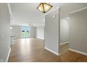Open-concept living room boasts hardwood floors and doors leading to the backyard at 1127 Kay Dr, Greenwood, IN 46142