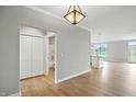 Spacious living area with hardwood floors connecting to an open bathroom and modern kitchen at 1127 Kay Dr, Greenwood, IN 46142