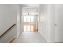 Bright hallway with tiled floor, wainscoting, and view to the living area at 13019 Pinner Ave, Fishers, IN 46037