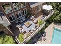 Spacious outdoor deck with comfortable seating, dining area, and a view of the pool at 14027 Waterway Blvd, Fishers, IN 46040