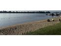 Sandy beach and lake water view on a sunny day at 20876 Waterscape Way, Noblesville, IN 46062