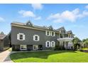 Side of two-story home with well-manicured lawn and bright green landscape at 2227 Hidden Orchard Ct, Indianapolis, IN 46228